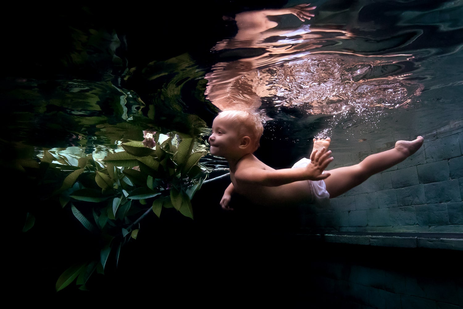 underwater baby photoshoot in pool in Bali